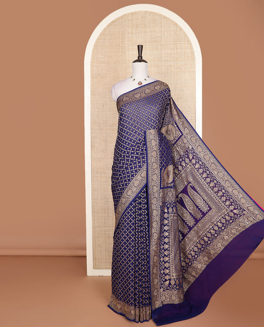 Blue jaal jacquard banarasi silk saree, floral creeper zari border, and pallu of Mughal-style intricate designs