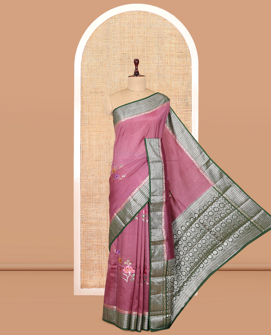 Pink Raw mango Silk Saree, Gracefully Embellished with Floral Embroidery Buttas, a Contrast Chevron Striped Border, Intricate Pallu, and a Contrast Blouse