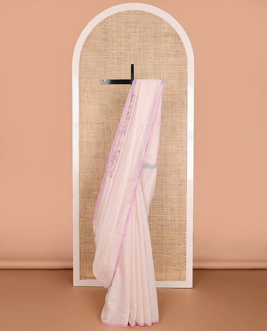 Pastel pink printed Chanderi cotton saree features floral motifs all over its border & pallu, contrast plain border