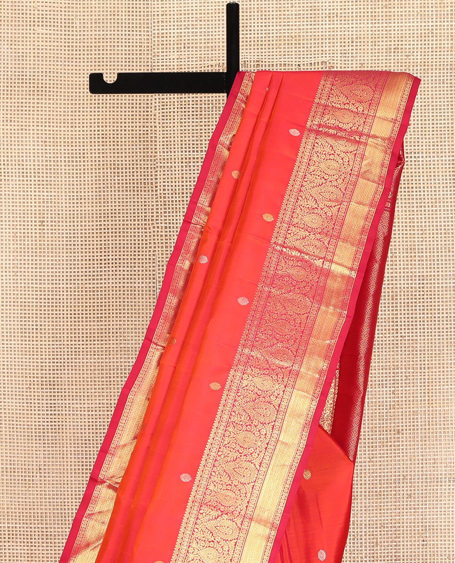 Orange Kanchipuram Silk Saree, Adorned with Zari Buttas All Over Its Body, Complemented by Contrast Border of Kamalam, Thilakam, and Mayil Kann Designs, Grand Jaal Pallu, and Paired with a Contrast Blouse