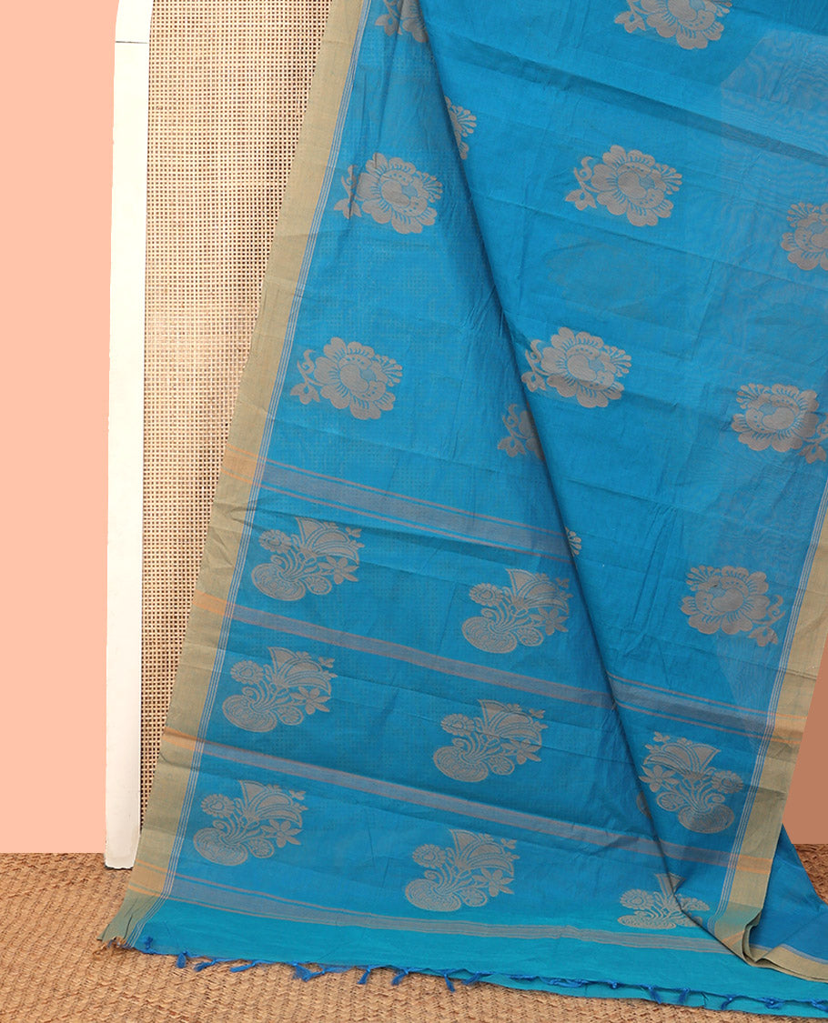 Blue Kanchi Cotton Saree, Subtly Sparkled with Floral Buttas All Over Its Body, Complemented by a Contrast Border, Pallu Steeped with Flower Vase Buttas, and Paired with a Matching Blouse