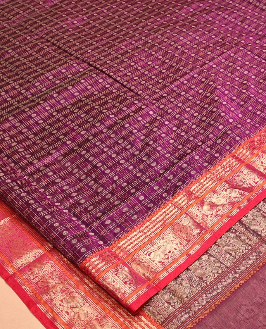 Purple Kuppadam Silk Saree, Adorned with Butta Enclosed Checks, a Contrast Traditional Peacock-Yaali Border, Pallu of Traditional Designs, and a Matching Blouse