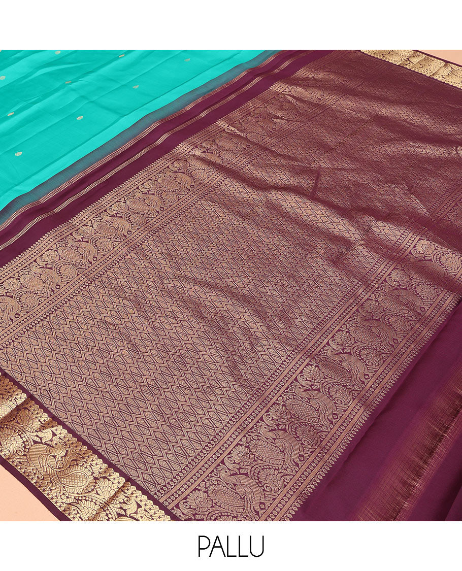 Blue Vasundhara Silk Saree, Adorned with Zari Buttas, a Contrast Korvai Border of Thilakam, Banaras, and Mayil Designs, Richly Woven Pallu, and a Contrast Blouse
