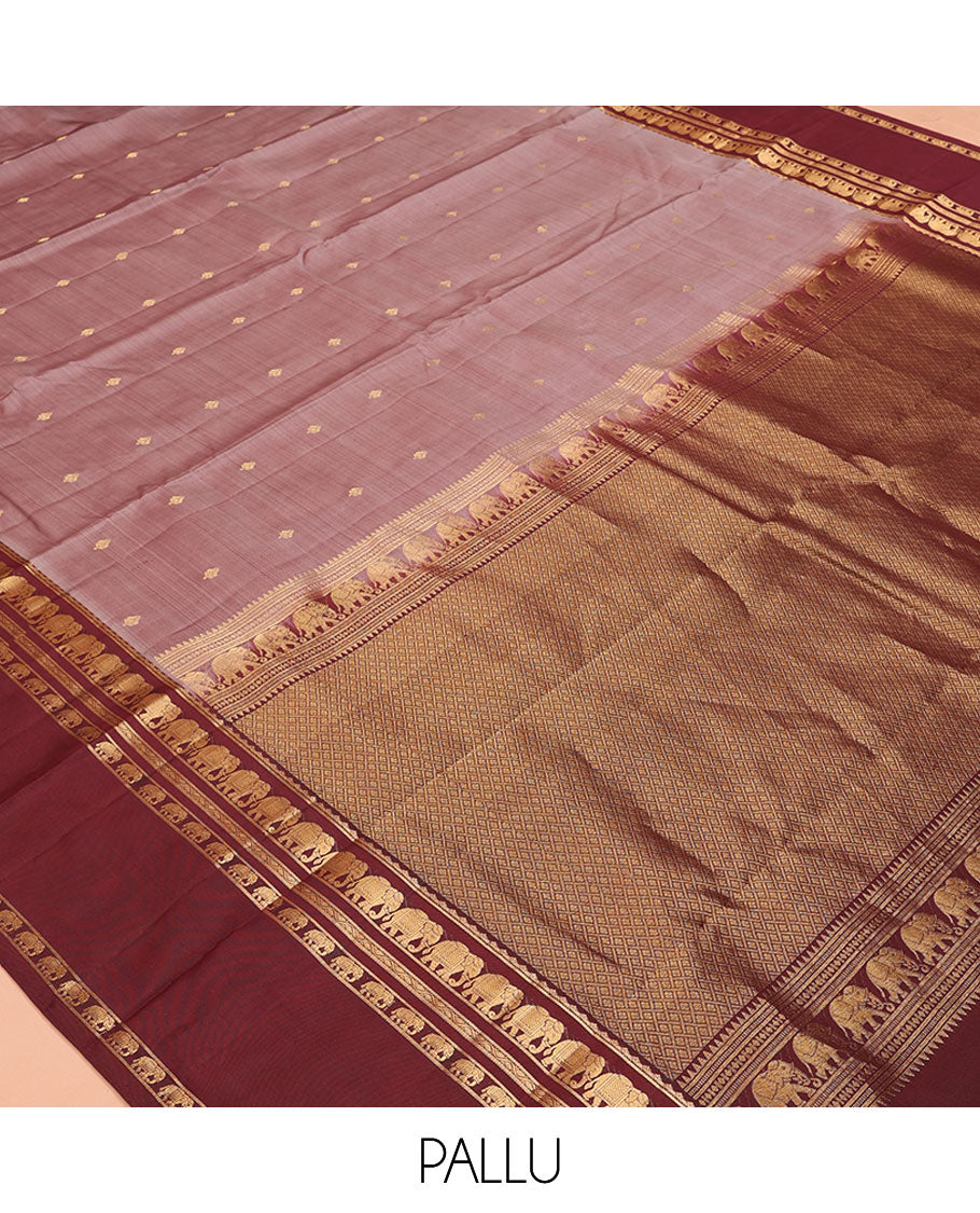Grey Vasundhara Silk Saree, Adorned with Zari Buttas All Over Its Body, Complemented by a Contrast Rettai Pettu Border of Yaanai Designs, Grand Jaal Pallu, and Paired with a Contrast Blouse