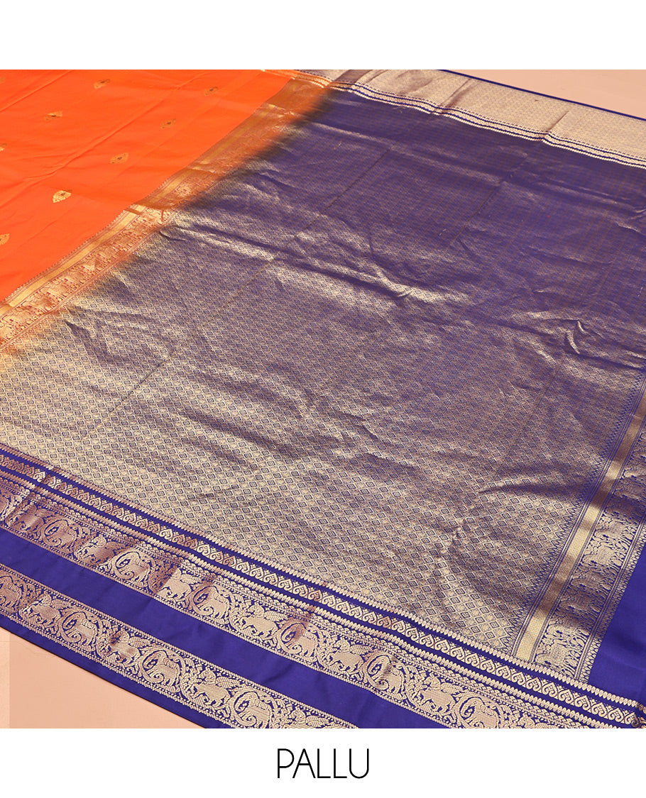 Orange Vasundhara Silk Saree, Adorned with Zari Buttas, Contrast Rettai Pettu Border of Yaanai, and Kuthirai Designs, Grand Pallu, and a Contrast Blouse