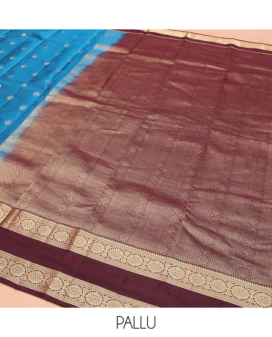 Blue Vasundhara Lite Silk Mix Saree, Adorned with Chakram Buttas All Over Its Body, Complemented by a Contrast Rettai Pettu Border of Rekku, Neli, and Chakram Designs, Pallu of Chakram and Jaal Designs, and Paired with a Contrast Blouse