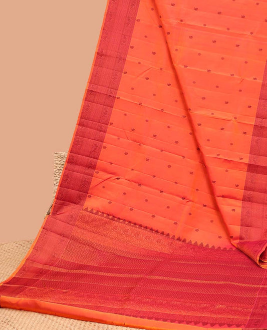 Orange buttas kancheepuram silk saree with contrast border of rekku, kathir,poo chakram, mayil, ara maadam design & zari design pallu
