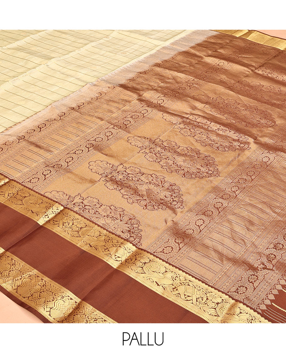 Pale Green Vasundhara Silk Saree, Enriched with Zari Buttas Enclosed Checks All Over Its Body, Complemented by a Contrast Rettai Pettu Border of Muthu, Banaras, and Iruthalai Pakshi Designs, a Grand Pallu, and Paired with a Contrast Blouse