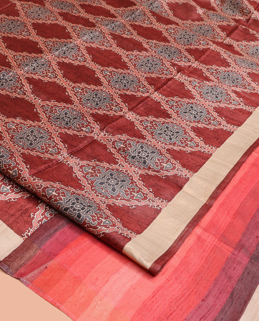 Terracotta Red Tussar Silk Saree, Boldly Accentuated with Ajrakh-Style Jaal Design on Its Body, a Subtle Border, Ombre-Style Striped Pallu, and Paired with a Contrast Blouse