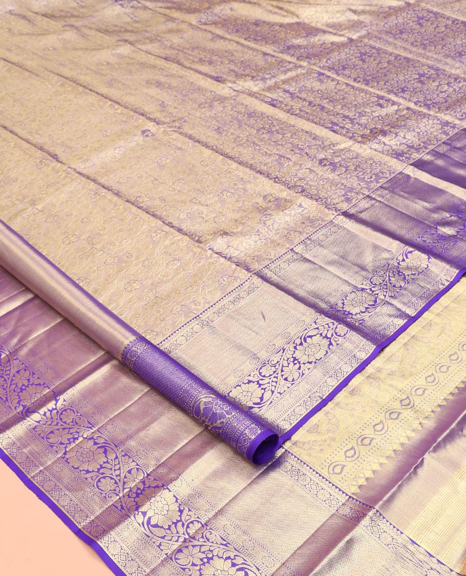 Blue Kanchipuram Tissue Silk Saree, Beautifully Bedecked with Floral Jacquard Designs on Its Body, Complemented by a Contrast Border of Thilakam, Kamalam, Diamond, and Kodi Visiry Designs, Intricately Designed Pallu, and Paired with Matching Blouse