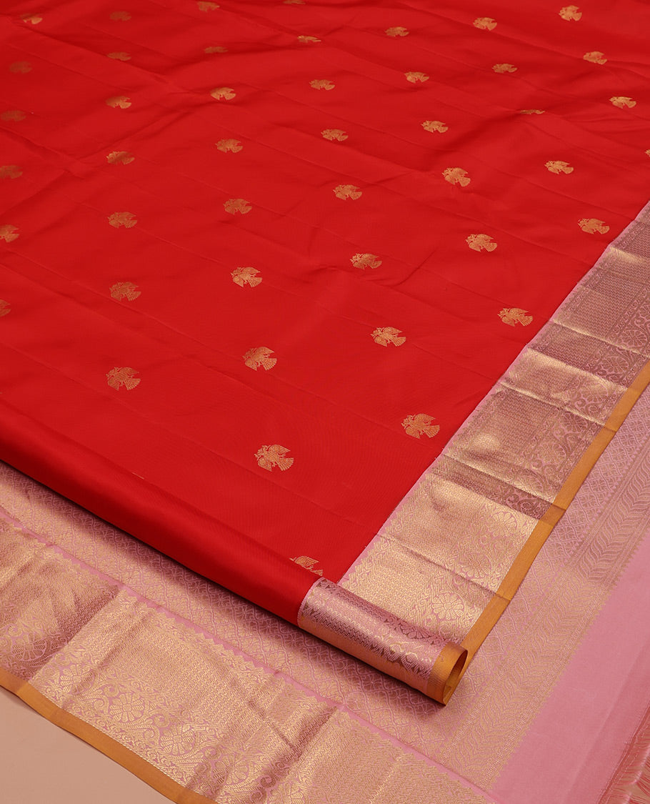 Red Vasundhara Silk Saree, Beautifully Bedecked with Iruthalai Pakshi Buttas All Over Its Body, Complemented by a Contrast Border of Rekku, Then Kuli Kann, and Kodi Visiry Designs, Grand Pallu, and Paired with a Contrast Blouse