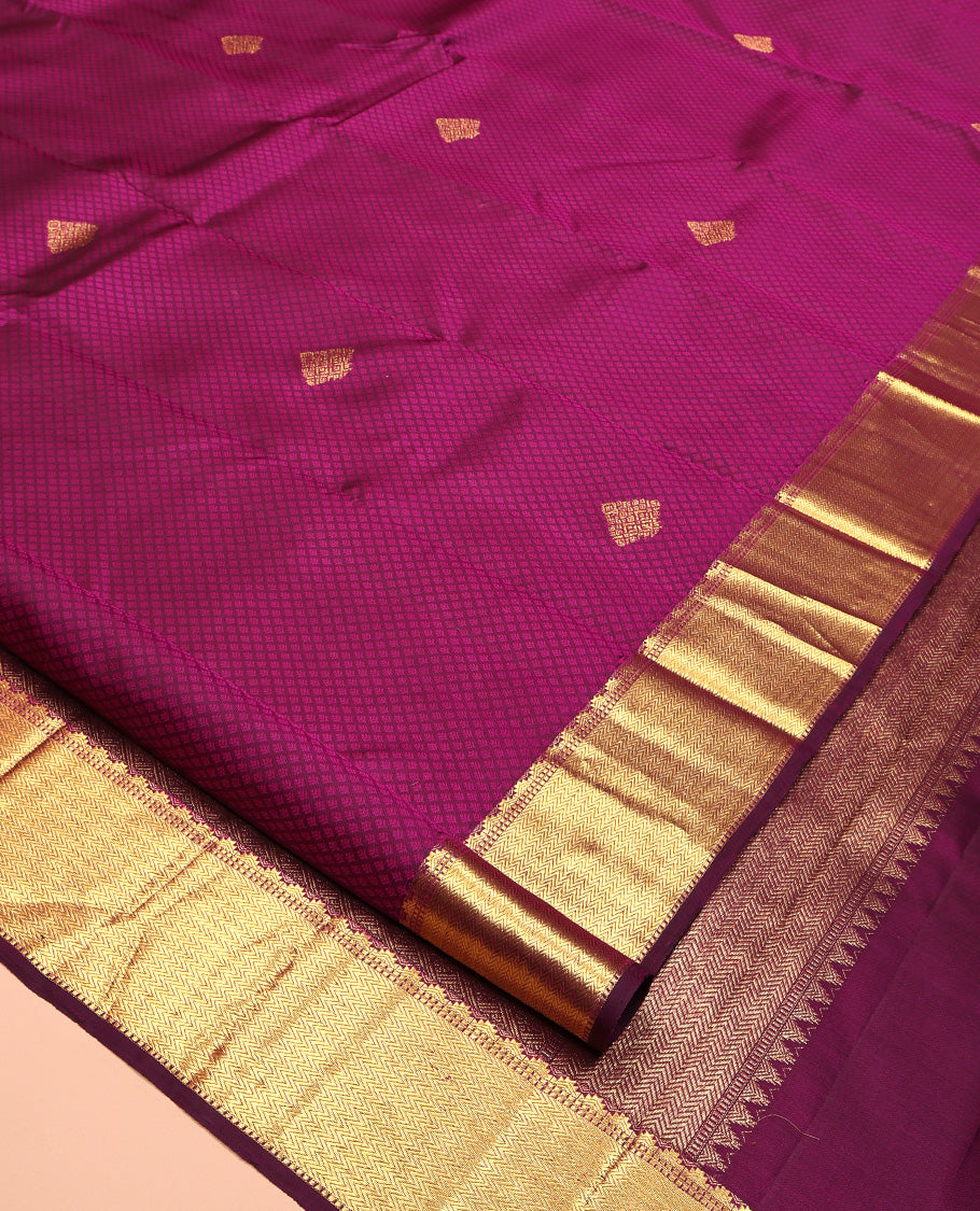 Wine Parampara Silk Saree, Enriched with Zari Buttas and Embossed Texture On Its Body, Highlighted by Zari Border of Thazampoo Rekku, Muthu, and Vanki Designs, Pallu Features Vanki Designs and Paired with a Matching Blouse