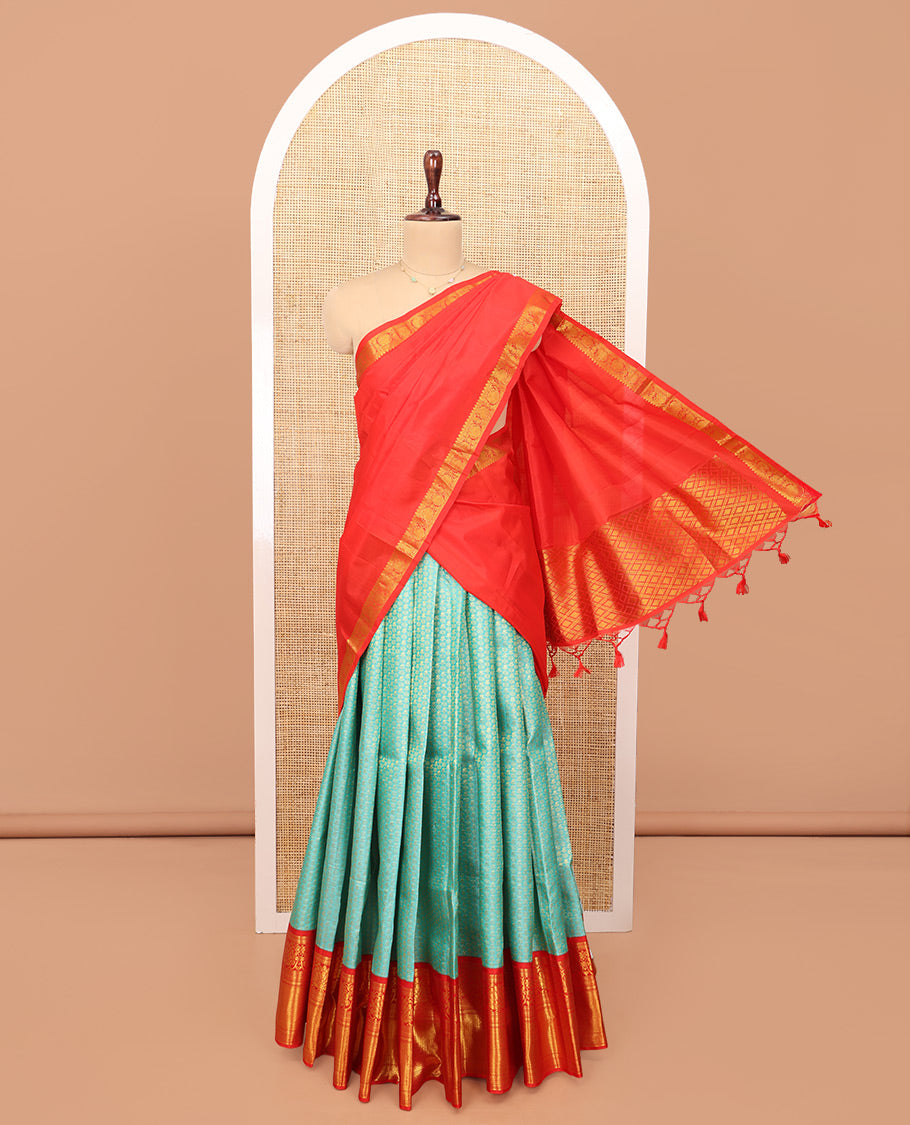 Blue Pure Silk Half-Saree, Gleamed Up with Zari Buttas on Its Skirt, Complemented by a Contrast Border Featuring Kodi Visiry, Neli, Muthu, and Jaal Designs, Comes with a Contrast Blouse and a Dhavani of Jaal Designs