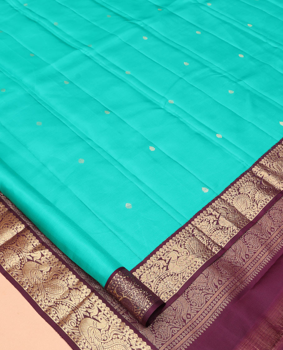 Blue Vasundhara Silk Saree, Adorned with Zari Buttas, a Contrast Korvai Border of Thilakam, Banaras, and Mayil Designs, Richly Woven Pallu, and a Contrast Blouse