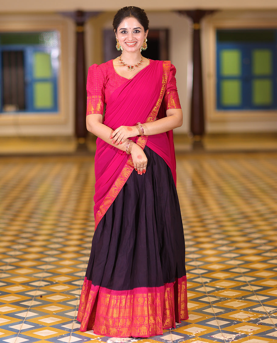 Violet and Rani Pink Plain Sungudi Cotton Half-saree, Complemented by Captivating Contrast Traditional Zari Border of Temple, Peacock, and Elephant Designs, Paired with a Contrast Zari Checked Blouse, and Comes with a Zari-Bordered Vichitra Silk Dhavani