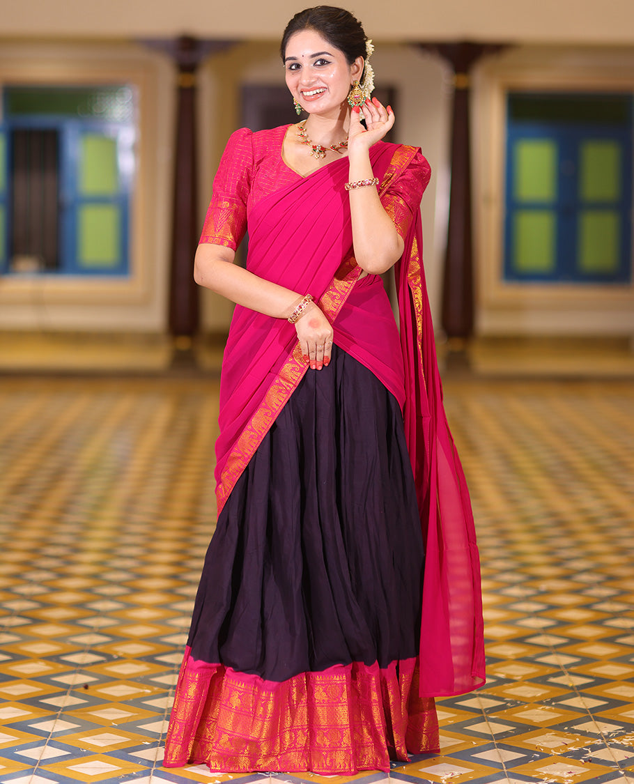 Violet and Rani Pink Plain Sungudi Cotton Half-saree, Complemented by Captivating Contrast Traditional Zari Border of Temple, Peacock, and Elephant Designs, Paired with a Contrast Zari Checked Blouse, and Comes with a Zari-Bordered Vichitra Silk Dhavani