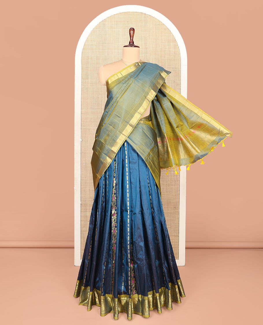 Blue Pure Silk Half-Saree, Adorned with Zari Designs on Its Body, Complemented by a Contrast Floral and Paisley Design Border, Complemented by a Contrast Blouse, and Paired with a Contrast Dhavani of Leaf-Paisley Designs