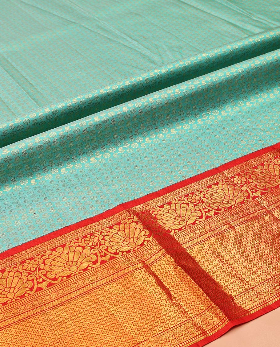 Blue Pure Silk Half-Saree, Gleamed Up with Zari Buttas on Its Skirt, Complemented by a Contrast Border Featuring Kodi Visiry, Neli, Muthu, and Jaal Designs, Comes with a Contrast Blouse and a Dhavani of Jaal Designs