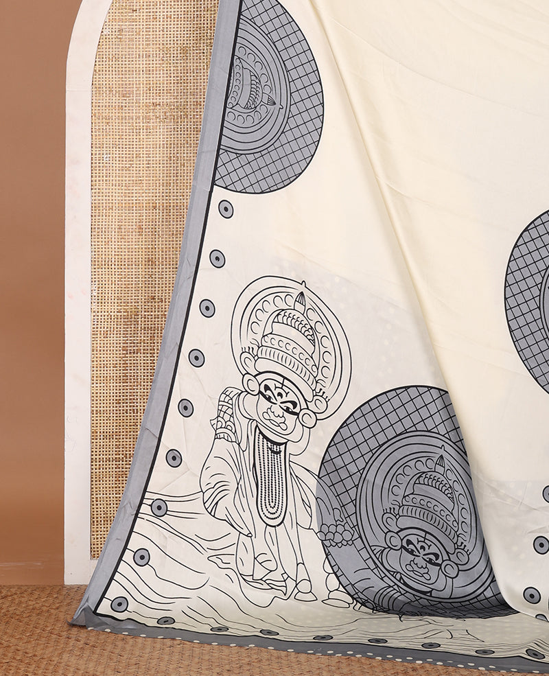 Cream printed semi-modal silk saree, contrast grey border of kathakali motif enclosed semi-circle, kathakali printed pallu & printed blouse