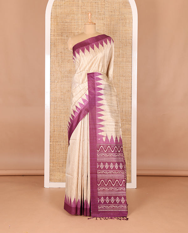 Chikku-purple plain Khicha katan silk saree, contrast purple temple border, ikkat printed pallu with tassels, and a contrast blouse