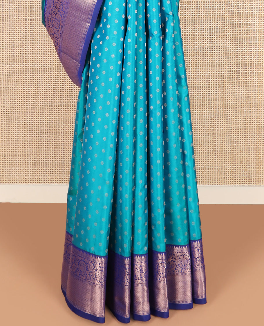 Blue zari buttas Vasundhara silk saree, contrast border of rekku, kodi visiry, and jaal designs, and zari-rich jaal pallu