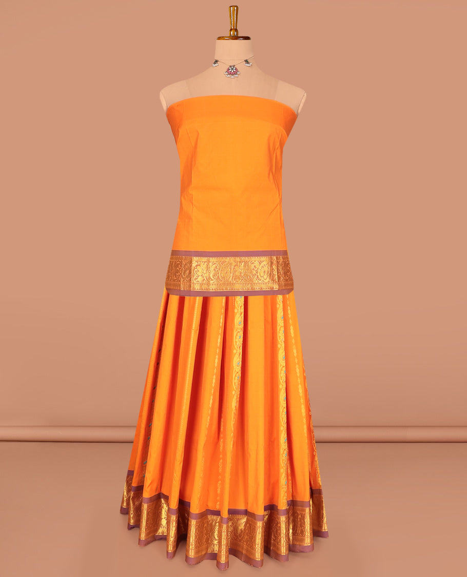 Orange Art Silk Pavadai Material Set, Woven with Zari Designs on Its Skirt, Complemented by a Contrast Traditional Zari Border, and a Matching Blouse