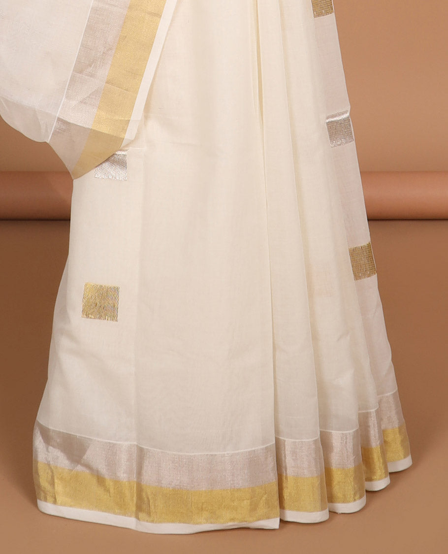 White geometric design kasavu saree with self gold zari border & gold striped pallu