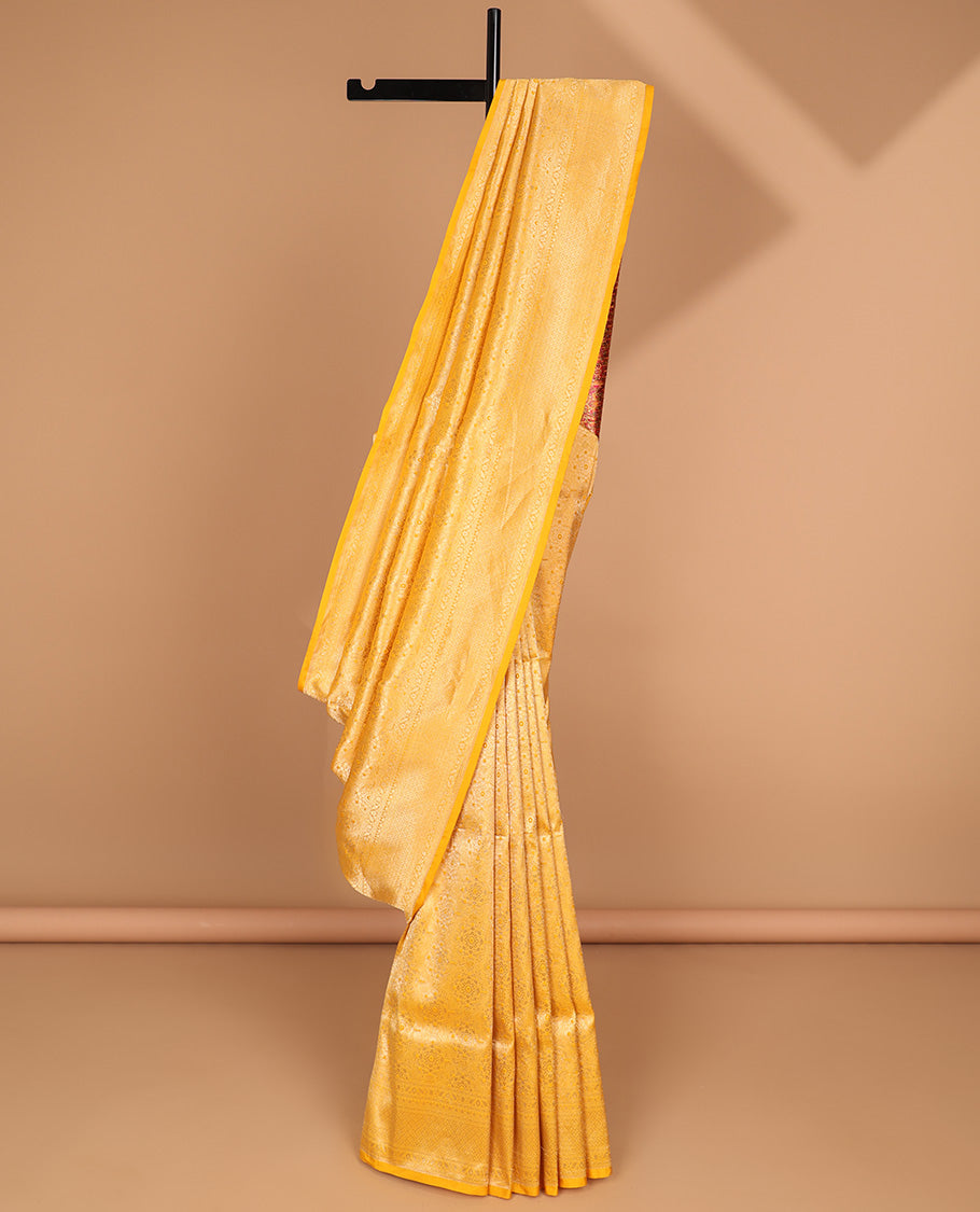 Yellow floral jacquard with self intricate zari design border & floral zari design pallu