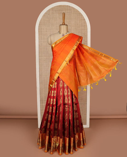 Maroon pure silk half saree, zari buttas skirt, contrast border and blouse of thilakam mokku, banaras, kathir, vanki, and mayil chakram design, and paiyaadi kattam dhavani