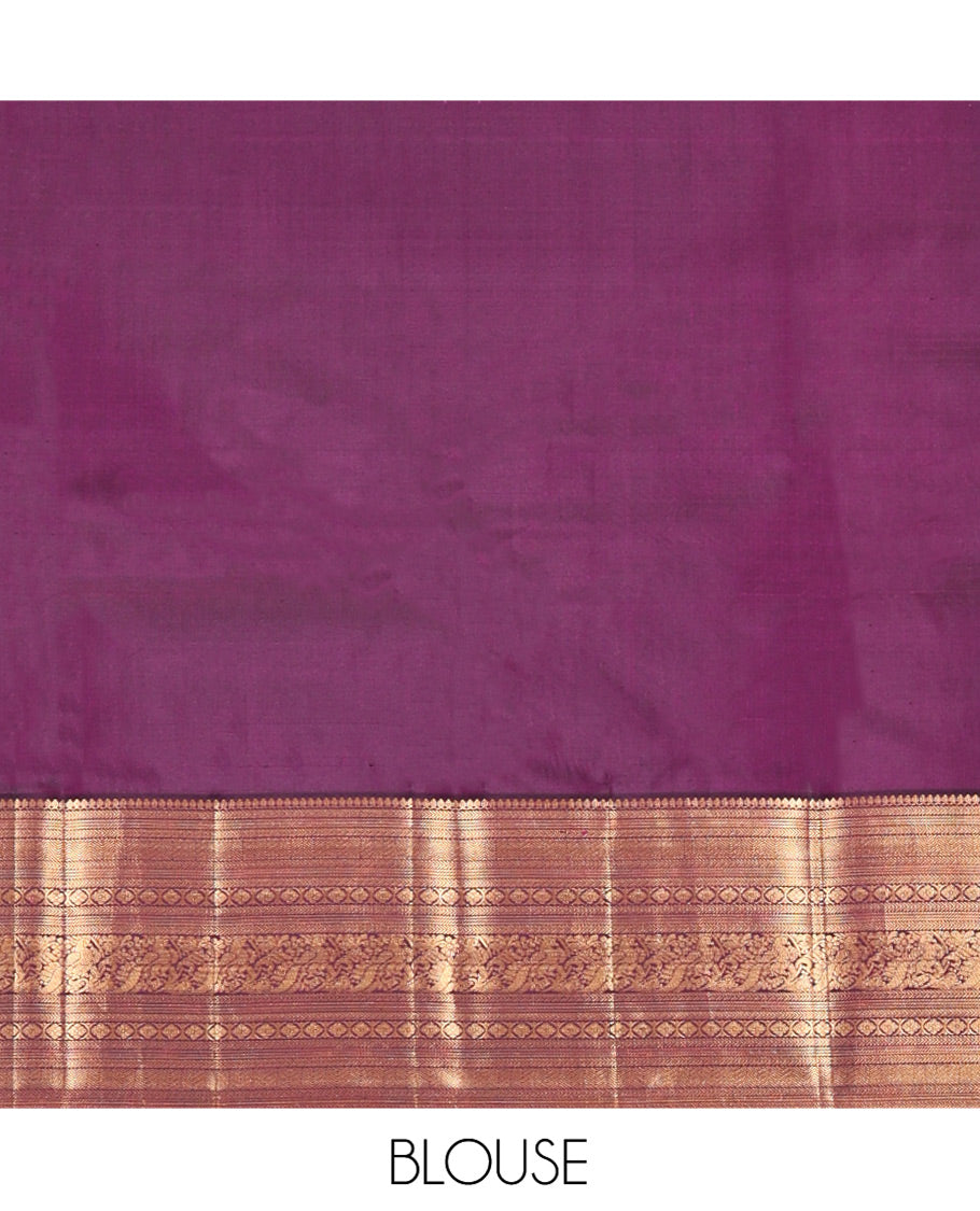 Orange Vasundhara Silk Saree, Gleamed Up with Stripes All Over Its Body, Complemented by a Contrast Border of Thilakam Mokku, Kathir, Vanki, Laddu Kamalam, and Mayil Designs, Intricately Designed Pallu, and Paired with a Contrast Blouse