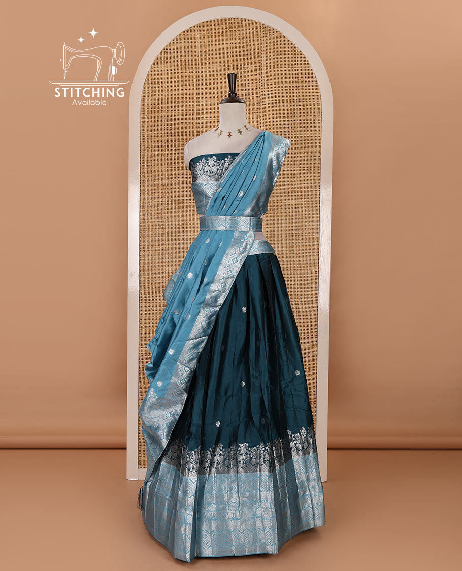 Bottle green-blue taffeta silk half-saree, zari buttas & contrast floral-geometric zari border skirt, zari woven blouse & contrast zari woven dhavani