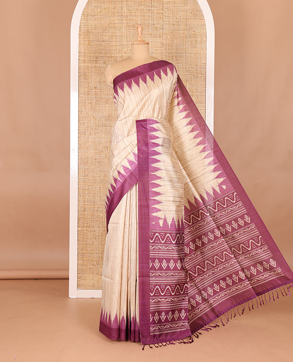 Chikku-purple plain Khicha katan silk saree, contrast purple temple border, ikkat printed pallu with tassels, and a contrast blouse