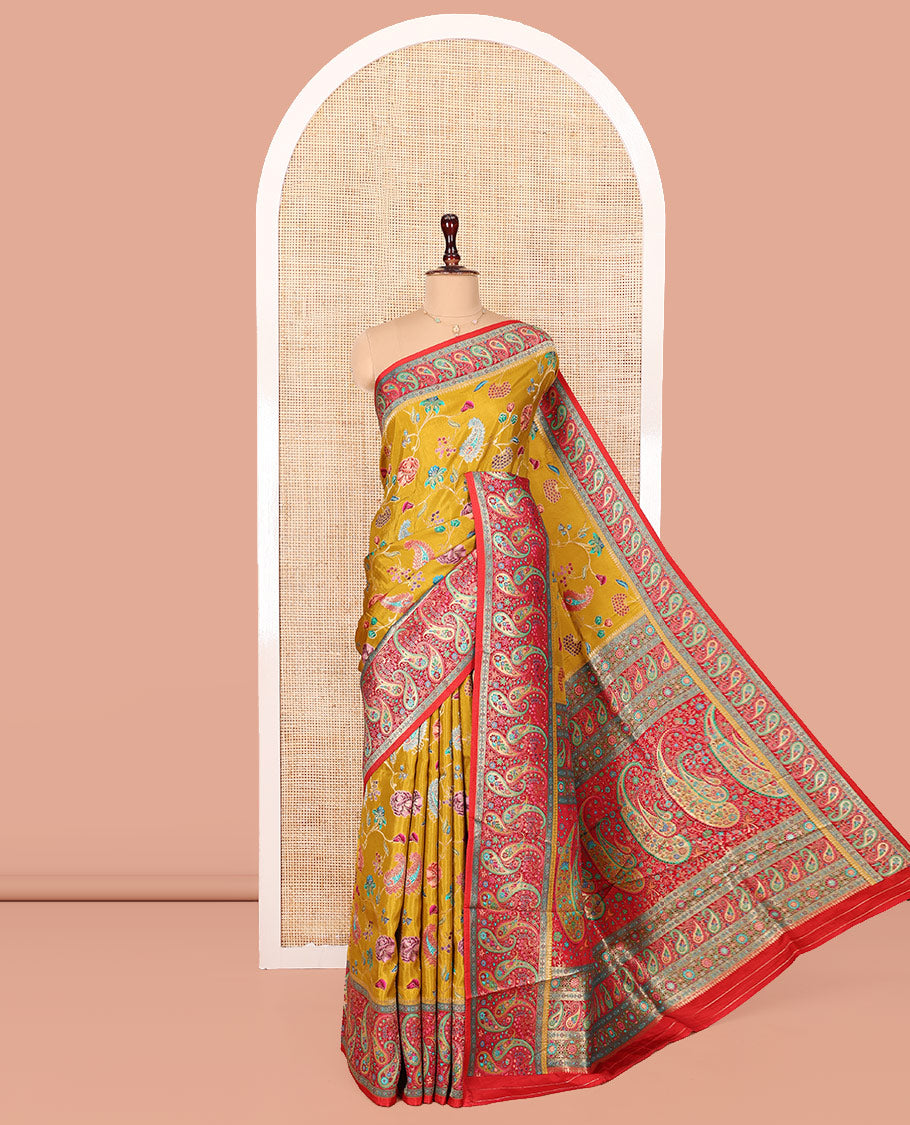 Mustard Dola Silk Saree, Elegantly Printed with Colorful Floral-Paisley Vine Design on Its Body, Complemented by Contrast Paisley Design Border, Pallu of Paisleys, and Paired with a Contrast Blouse