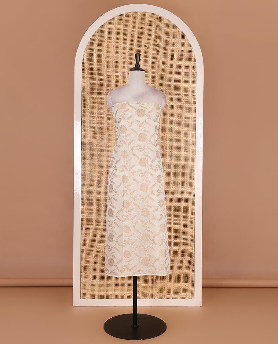 Cream with pista green semi-chanderi material churidar set, floral jaal jacquard top, contrast taffeta silk bottom, and jamdani style dupatta