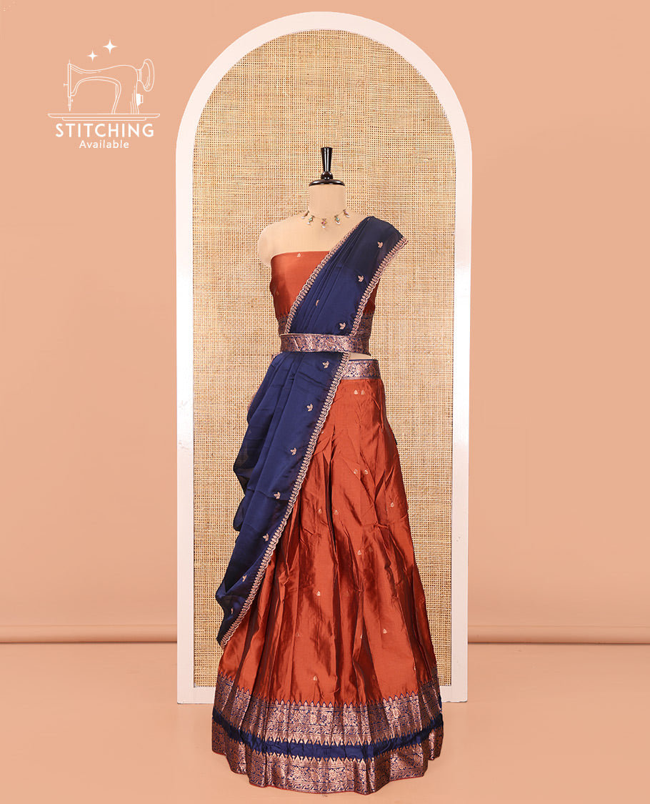 Rust and Blue Semi-Banarasi Half-Saree, Accentuated with Zari Buttas on Its Skirt, Complemented by a Contrast Rettai Pettu Traditional Zari-Design Border, Paired with a Matching Blouse, and Comes with a Contrast Satin Georgette Embroidered Dhavani