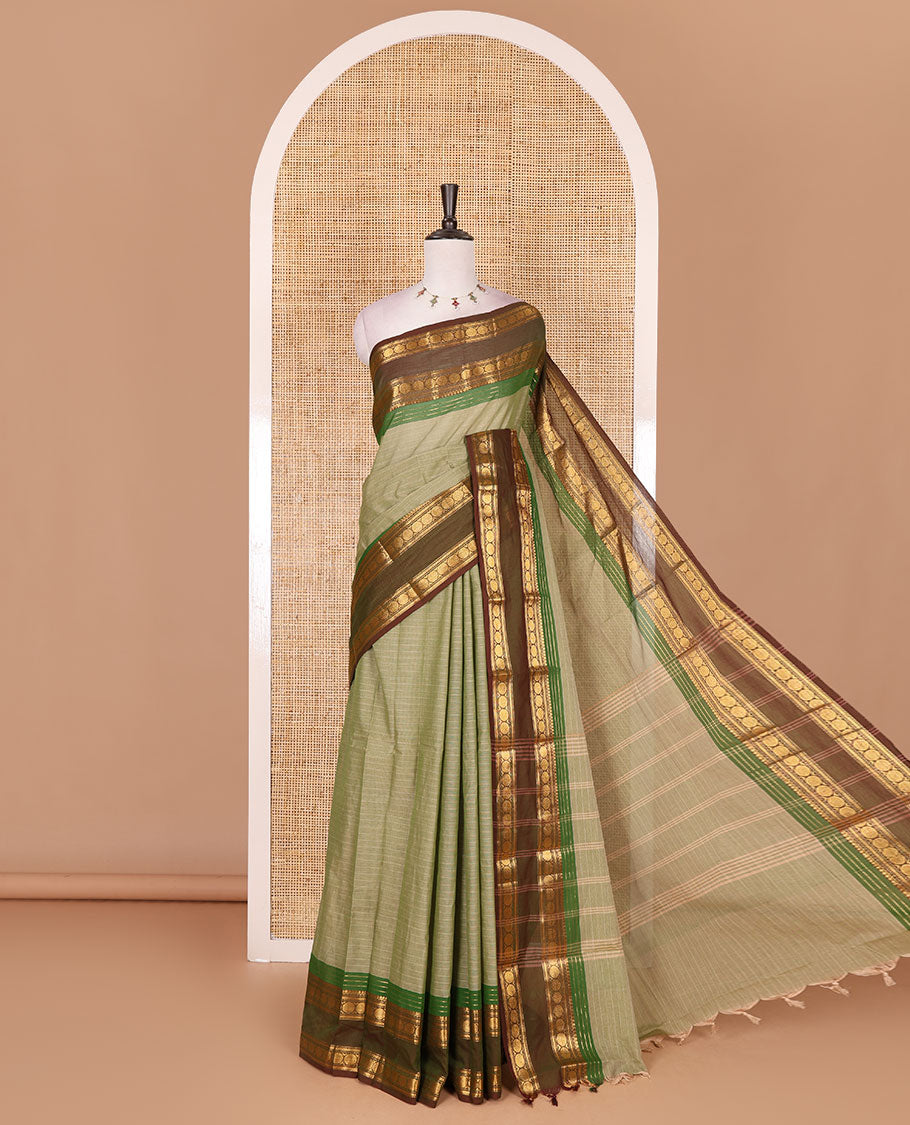 Green striped Chettinad cotton saree, contrast rettai rettu rudraksham motif zari border, striped pallu, and matching blouse
