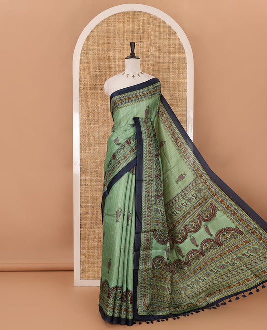 Green madhubani-style fish printed khadi cotton saree, floral printed border, madhubani printed pallu & contrast polka dots printed blouse