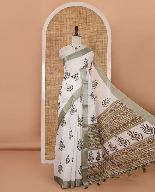 White unique motifs printed linen saree, contrast bavanji silver zari border, floral-geometric printed pallu & green motifs printed blouse