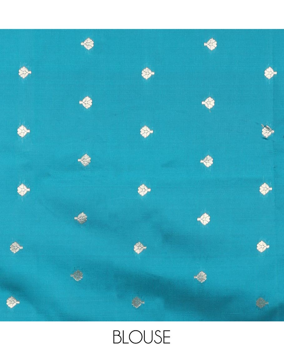 Blue Plain Semi-Soft Silk Saree, Adorned with Traditional Zari Designs Woven Border, Grandly Woven Pallu Steeped with Chakram Designs, and Paired with a Matching Blouse