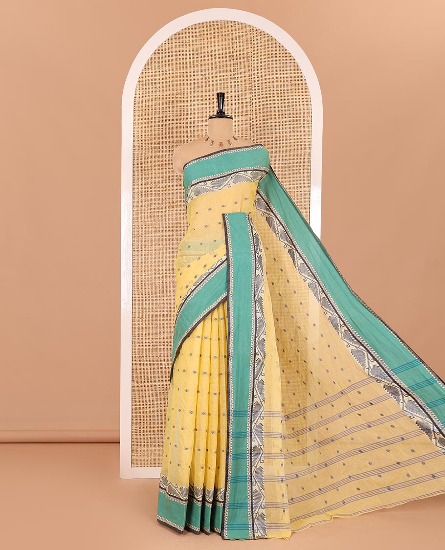 Yellow buttas Bengal cotton saree, contrast jamdani floral creeper design, and pallu of stripes, and buttas