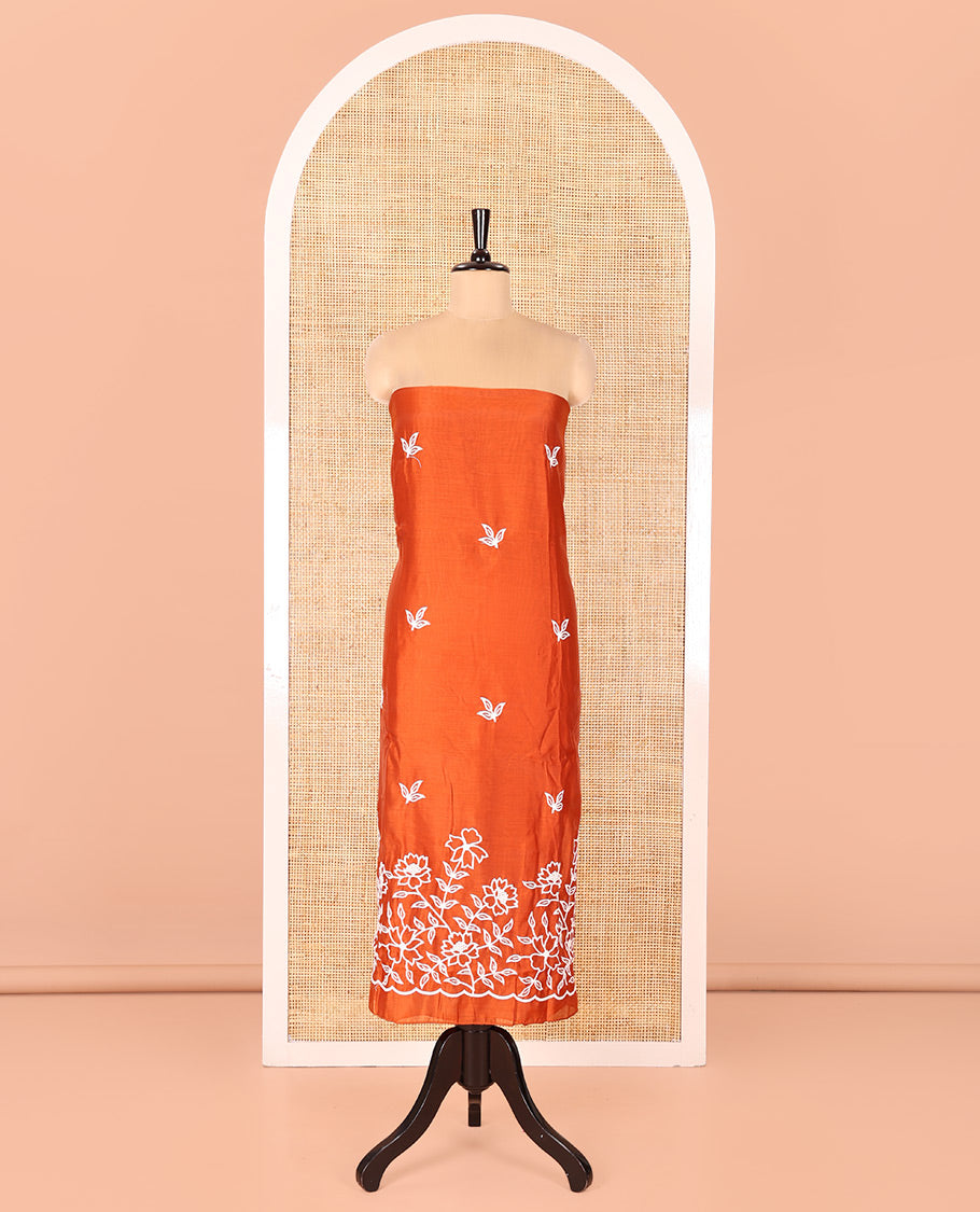 Rust Mul Chanderi Material Chudidar Set, Delicately Woven with Floral Embroidery on Its Top, a Plain Santoon Bottom, and Paired with a Floral Embroidered Scallop Dupatta