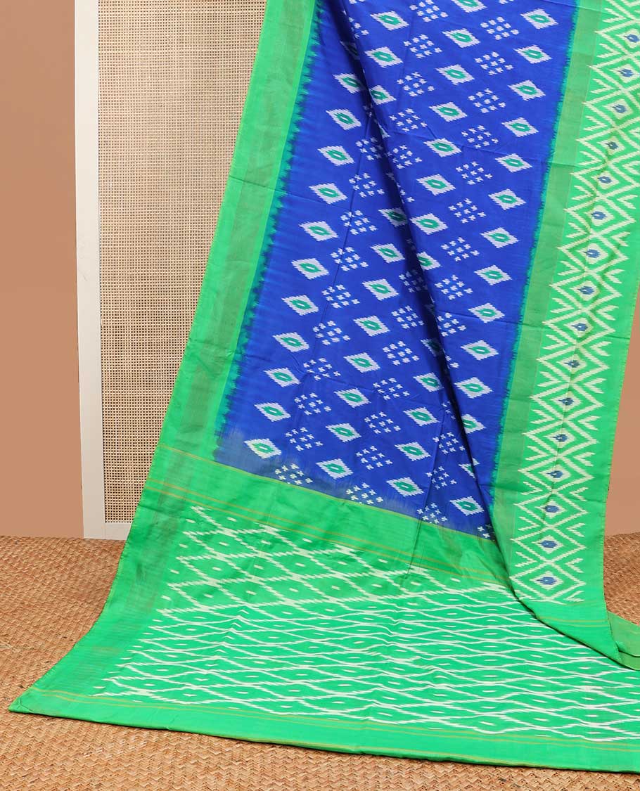 Blue floral design ikkat saree with contrast geometric design border & argyle design pallu