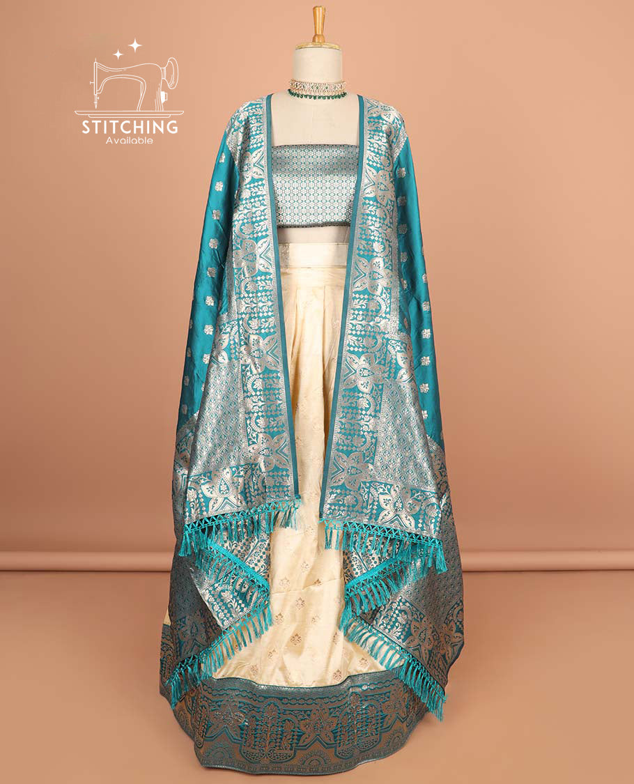Cream buttas half saree with contrast zari design border, zari design blouse & light blue floral zari design dhavani