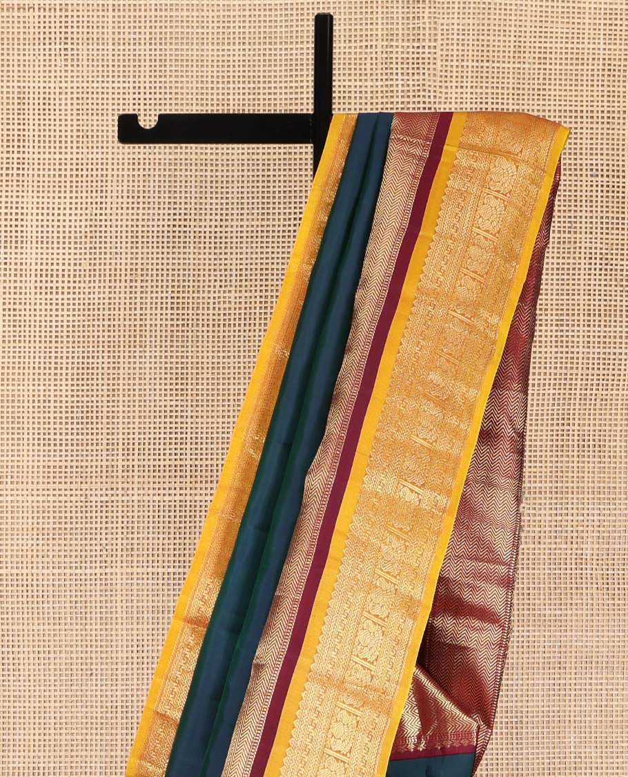 Blue Plain Kanchipuram Silk Saree, Complemented by a Contrast Border of Muthu, Vanki, Rekku, Neli, and Iruthalai Pakshi Designs, Gleaming Jaal Pallu, and Paired with a Contrast Blouse