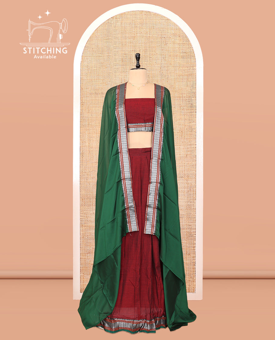 Maroon Cotton Half-Saree Features Plain Skirt, a Contrast Traditional Border, a Matching Blouse, and a Contrast Dhavani