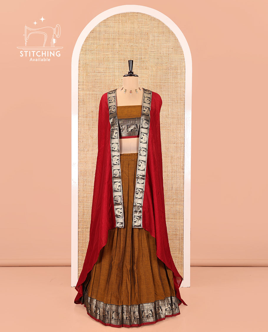 Mustard-Red Mercerised Cotton Half-Saree Features Plain with Contrast Traditional Zari Bordered Skirt, Paired with a Matching Blouse, and Comes with a Contrast Bordered Dhavani