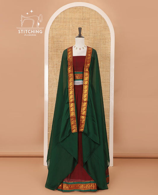 Maroon mercedised cotton half-saree, plain contrast elephant zari border skirt, matching blouse & contrast green zari elephant border dhavani