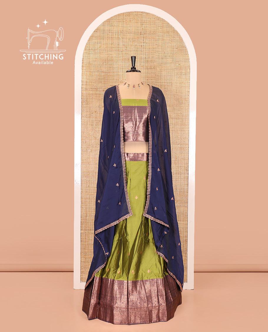 Green and Navy Blue Semi-Banarasi Half-Saree, Ornamented with Zari Buttas on Its Skirt, Complemented by a Contrast Traditional Zari Designs Woven Border, Paired with a Matching Blouse, and a Contrast Satin Georgette Embroidered Scallop Dhavani