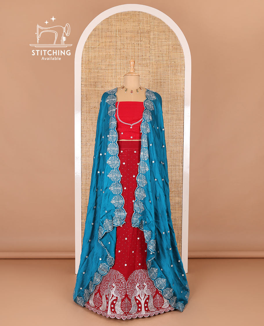Tomato red half-saree, buttas, tree, and peacock motifs embroidered semi-taffeta silk top, matching blouse, and contrast scallop embroidered dhavani