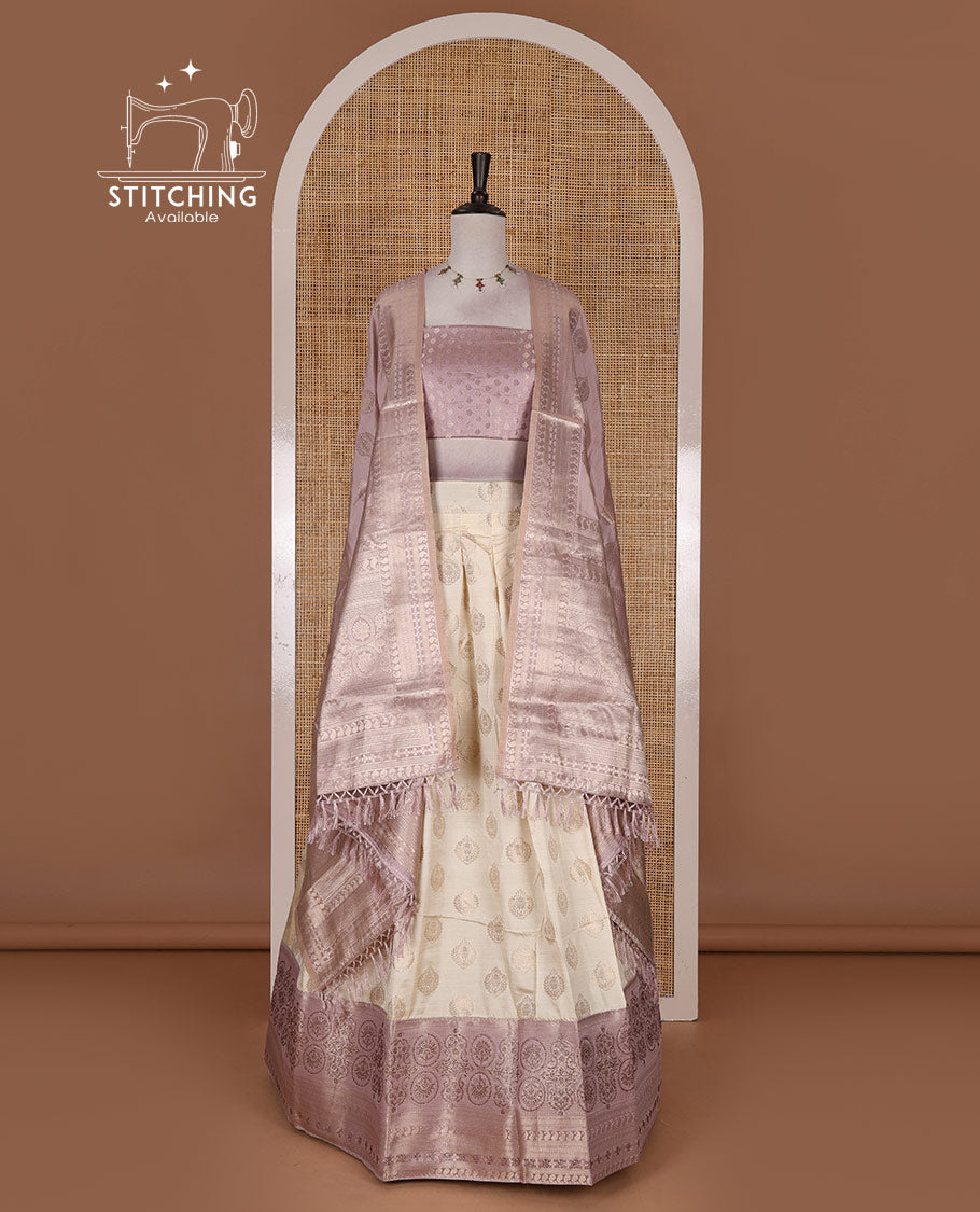 Cream and lavender semi-banarasi half-saree, zari buttas with contrast swarovski stone work border skirt, contrast zari buttas blouse, and intricate zari dhavani